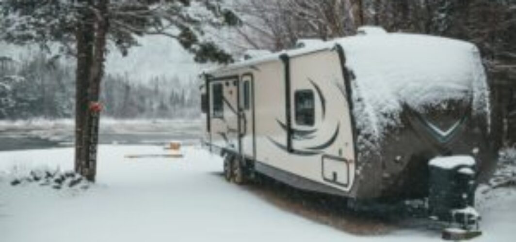 Winter RV camping adventure. An RV nestled in a snowy landscape. Ways to Insulate Your RV